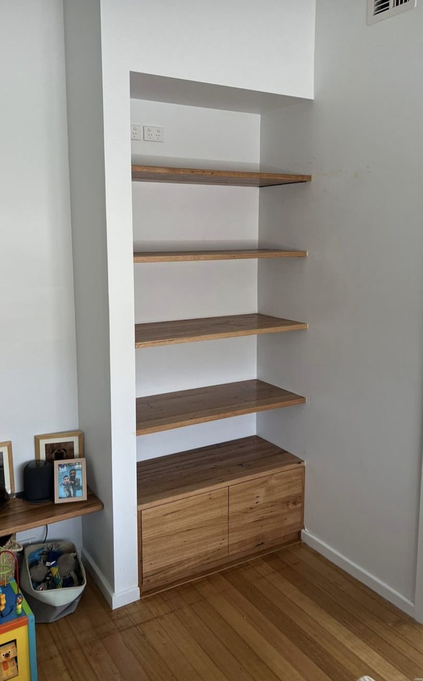 Custom built-in alcove shelving with cabinet